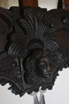 A giant Ceredigion greater horseshoe bat, hanging from an English 17th century hand-carved oak frame
