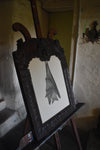 A giant Ceredigion greater horseshoe bat, hanging from an English 17th century hand-carved oak frame