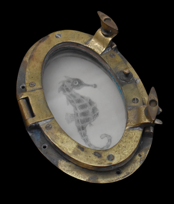 Seahorse in a brass porthole, 19th century