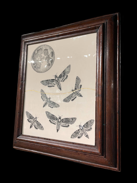 Death's head moths under a full-moon, presented in a hand-carved Welsh oak frame, circa 1800, with 23.75 carat gold kintsugi