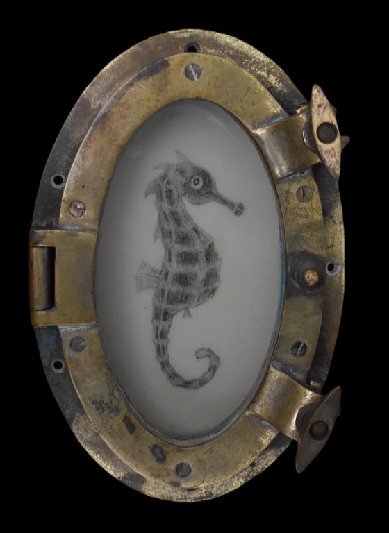 Seahorse in a brass porthole, 19th century